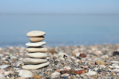 Stack of stones on beach, space for text. Harmony and balance concept