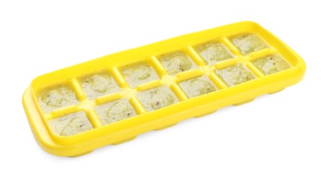 Kiwi puree in ice cube tray isolated on white. Ready for freezing