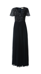 Beautiful long black party dress with paillettes on white background