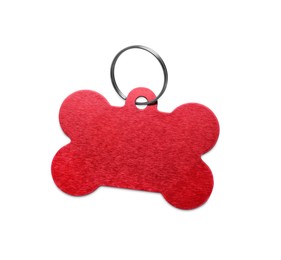 Red metal bone shaped dog tag with ring isolated on white
