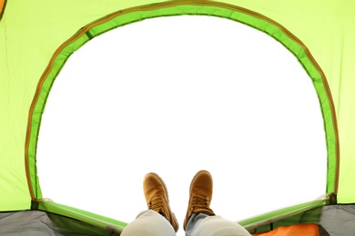 Closeup of man in camping tent on white background, view from inside