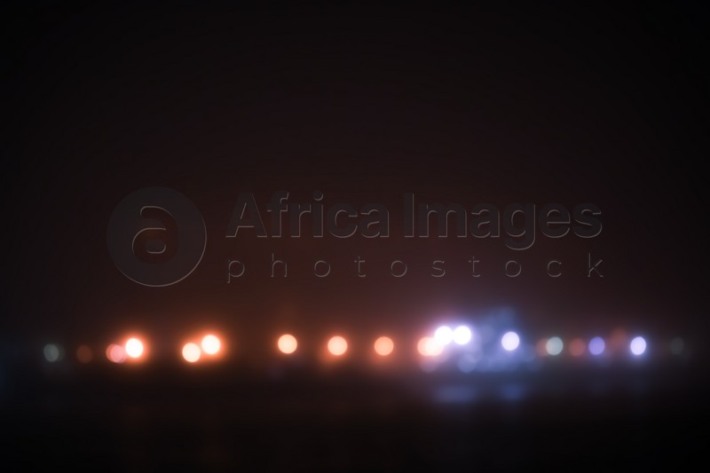 Photo of Blurred view of night city. Bokeh effect
