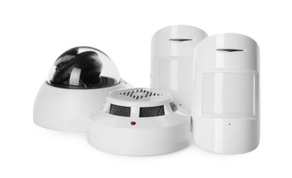 CCTV camera, smoke and movement detectors on white background. Home security system