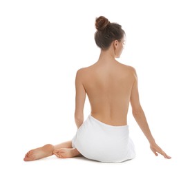 Back view of woman with perfect smooth skin sitting on white background. Beauty and body care