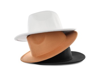 Photo of Stylish hats isolated on white. Trendy headdress