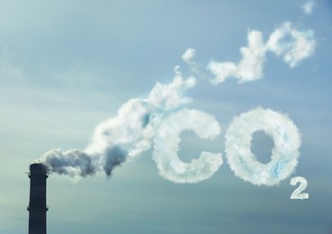 Inscription CO2 made of smoke. Polluting air from industrial chimney outdoors 