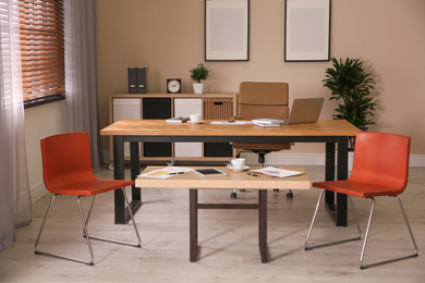 Director's office with large wooden table. Interior design