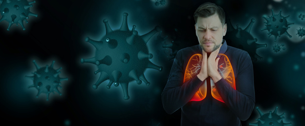 Man with diseased lungs and viruses around him on dark background