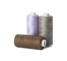 Spools of different sewing threads isolated on white