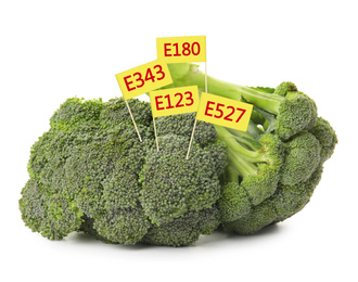 Broccoli with E numbers on white background. Harmful food additives 