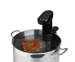Thermal immersion circulator and meat in pot on white background. Vacuum packing for sous vide cooking