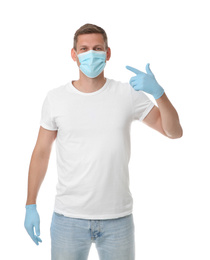 Male volunteer in mask and gloves on white background. Protective measures during coronavirus quarantine