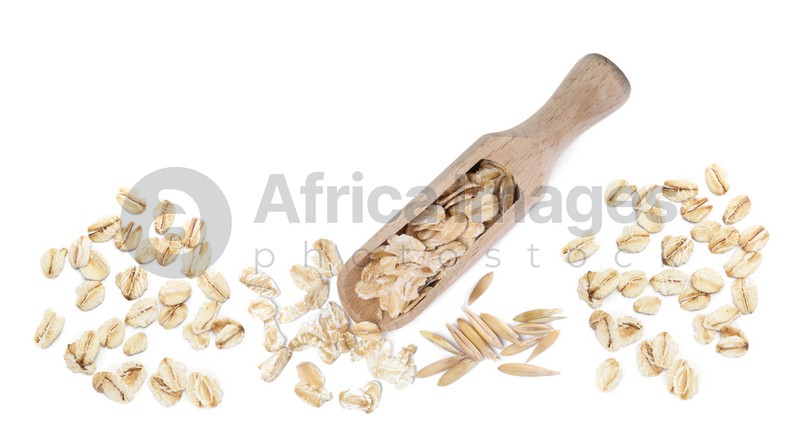 Uncooked oatmeal and wooden scoop on white background, top view. Banner design 