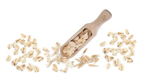 Uncooked oatmeal and wooden scoop on white background, top view. Banner design 