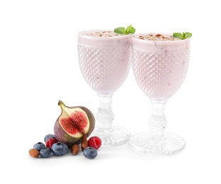 Delicious fig smoothies and ingredients on white background