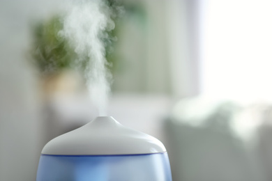 Modern air humidifier indoors, closeup. Space for text