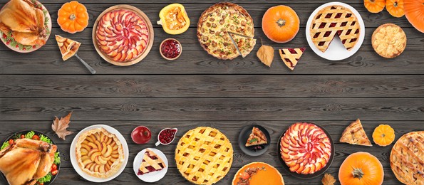 Flat lay composition with different tasty pies on wooden table, space for text. Banner design