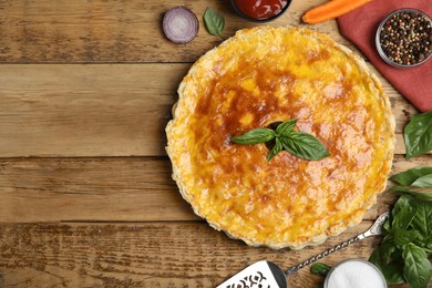 Delicious pie with minced meat on wooden table, flat lay. Space for text