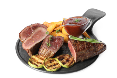 Delicious sliced beef tenderloin served with fried potatoes isolated on white