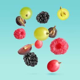 Image of Different fresh berries falling on light blue background