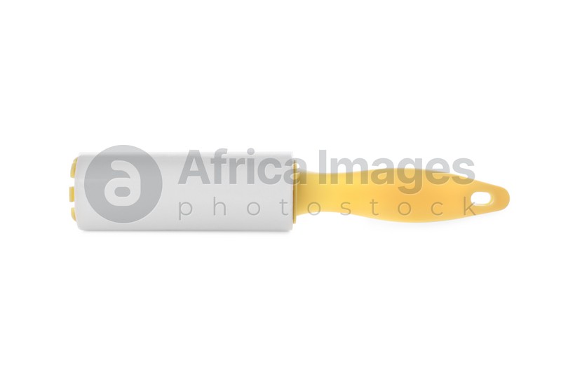 Photo of New lint roller with yellow handle isolated on white