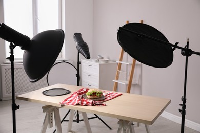 Composition with tasty sandwich on table in photo studio. Food photography