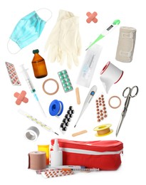 First aid kit. Different medical supplies falling on white background