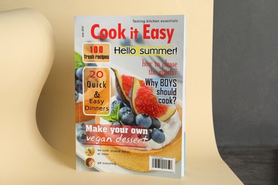 Modern printed culinary magazine on yellow background