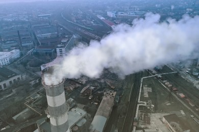 CO2 emissions. Industrial factory polluting air with smoke outdoors, aerial view