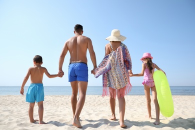 Family at beach on sunny summer day
