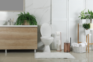 Stylish toilet bowl in modern bathroom interior