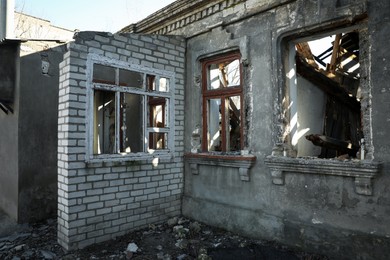 Ruined house with broken windows after strong earthquake