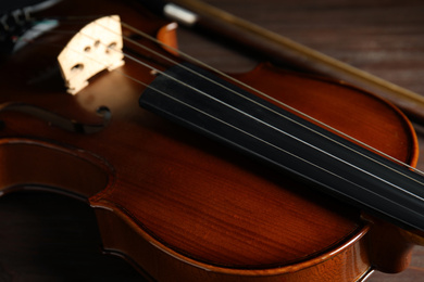 Classic wooden violin on table, closeup view