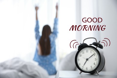 Good Morning! Young woman stretching at home, focus on alarm clock