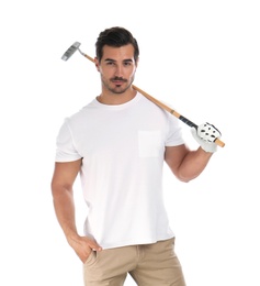 Young man posing with golf club on white background