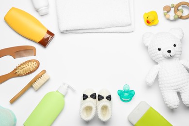 Photo of Flat lay composition with baby cosmetic products on white background, space for text