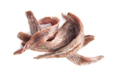 Photo of Heap of delicious anchovy fillets on white background, top view