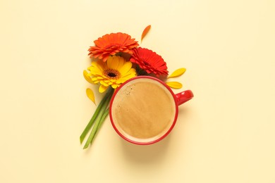 Photo of Beautiful colorful gerbera flowers, petals and cup of coffee on beige background, flat lay