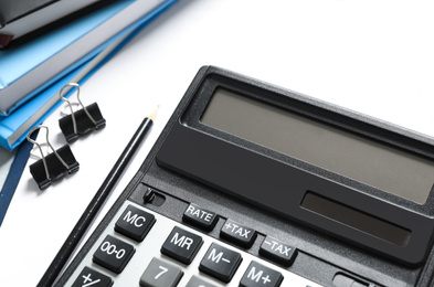 Calculator and stationery on table, closeup. Tax accounting