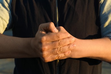 Photo of Angry man with clenched fist, closeup view