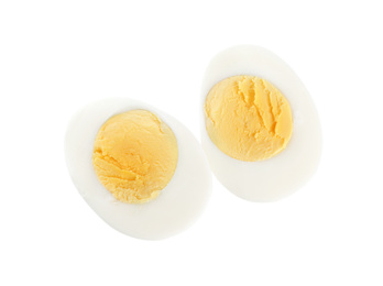 Halves of fresh hard boiled chicken egg isolated on white, top view