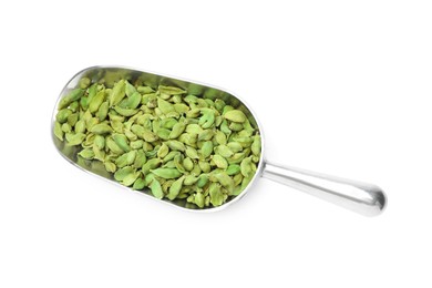 Metal scoop with dry cardamom seeds isolated on white, top view