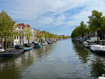 Photo of Beautiful view of buildings near canal and boats on sunny day