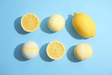 Photo of Flat lay composition with bath bombs and lemons on color background