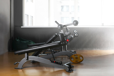 Abdominal bench in gym. Modern sport equipment