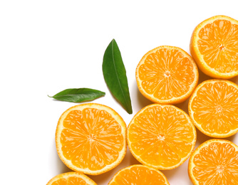 Composition with halves of fresh ripe tangerines and leaves on white background, top view. Citrus fruit