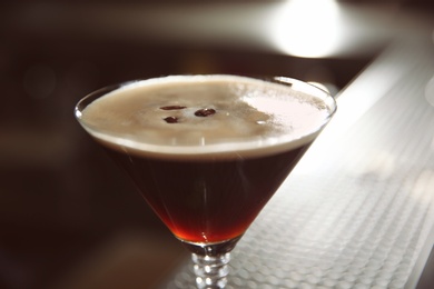 Glass of martini espresso cocktail in bar, closeup