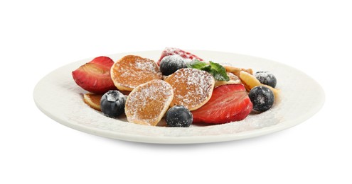 Plate with cereal pancakes and berries isolated on white