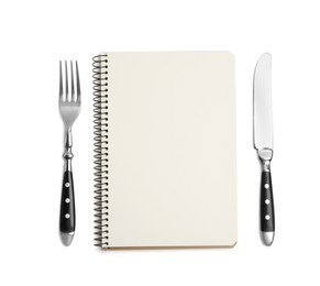 Blank recipe book and cutlery on white background, top view. Space for text