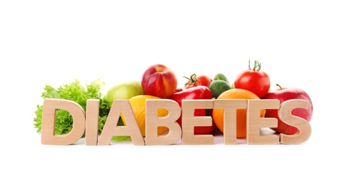 Word DIABETES and healthy food on white background